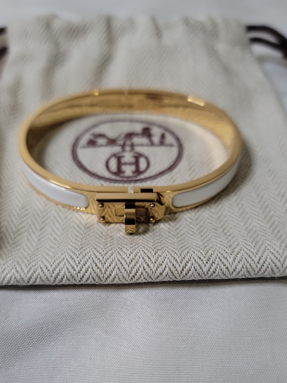 Hermes White and Gold Clic Clac Bracelet